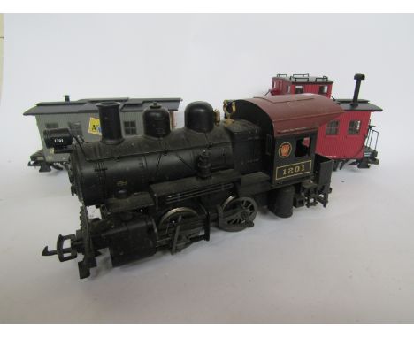 An Aristo-Craft G gauge 1201 0-6-0 locomotive and two wagons