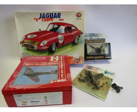 A Burago 1:18 scale Jaguar model kit together with a Corgi Spitfire model and book gift set, Corgi Fighting Machines helicopt