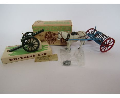 A boxed Britains 9700 Royal Artillery Gun with six shells and an unboxed Britains horse drawn rake (2)