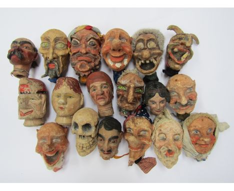 A collection of early 20th Century composition and carved wooden puppet heads