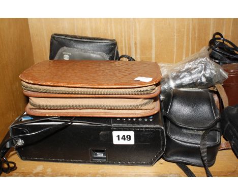 A quantity of assorted cameras, to include an Alpa 9d camera, binoculars, tripods, cassette recorder, men's travel set, etc.