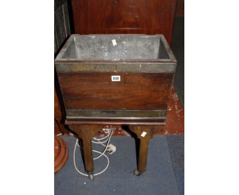 A Georgian brass banded mahogany wine cooler and a Chinese lacquered and mother of pearl inlaid tea caddy.