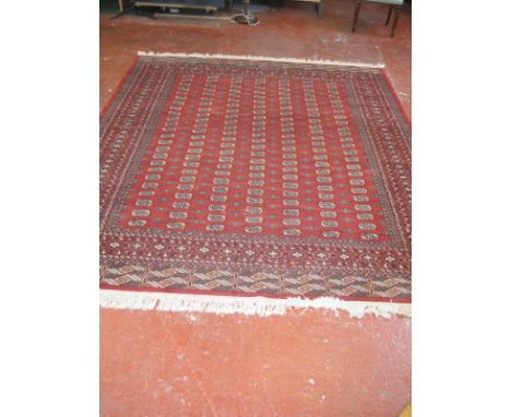 A Bokhara carpet approx 310 x 110cm
