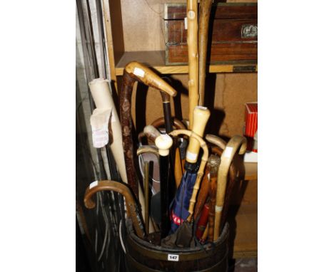 A quantity of assorted walking sticks, to include a silver mounted walking stick, an ebony and ivory walking sick, various ot