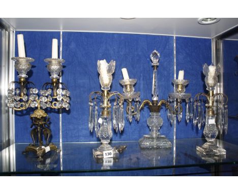 A pair of glass candlesticks, with lustres, 32cm high (af), a twin branch candlestick, glass and metal mounted and another tw
