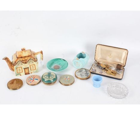 Festival of Britain 1951 collectables, to include a cottage teapot, four compacts, barrel ashtray two dishes, blue pressed gl