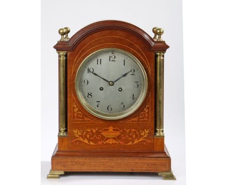 Late Victorian mahogany and marquetry inlaid mantel clock, the arched case with orb form brass finials and columns, the silve