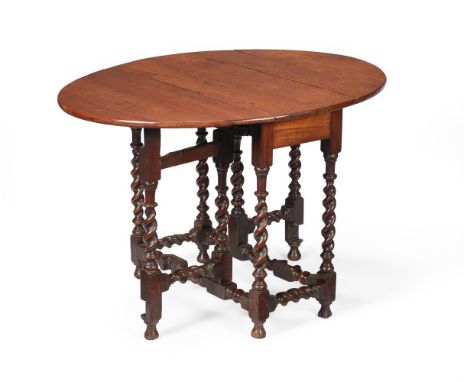 A WALNUT GATE-LEG OVAL TABLE 18TH CENTURY 71cm high, 107cm wide (when open), 87cm deep Condition Report: Marks, knocks, scrat