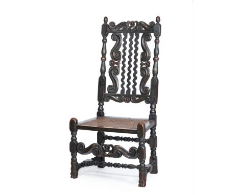 A STAINED OAK SIDE CHAIRLATE 17TH CENTURY AND LATERwith pierced c-scroll carved toprail and cane filled backs flanked by turn