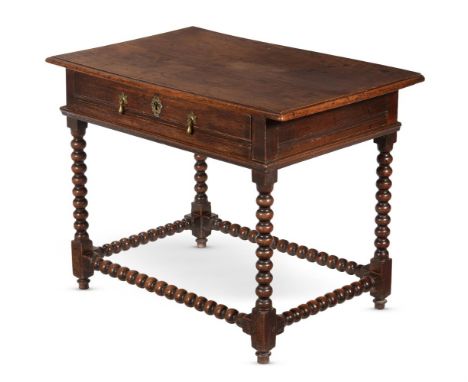 A WILLIAM & MARY OAK SIDE TABLECIRCA 1690On bobbin turned legs and stretchers74cm high, 95cm wide, 62cm deep Condition Report
