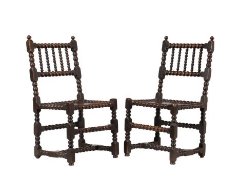 A PAIR OF OAK SIDE CHAIRSLATE 17TH CENTURY With bobbin turnings throughoutEach 91cm high