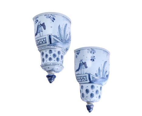 A PAIR OF ENGLISH DELFT BLUE AND WHITE WALL POCKETS, PROBABLY LAMBETH MID-18TH CENTURYPainted with a single figure in a terra