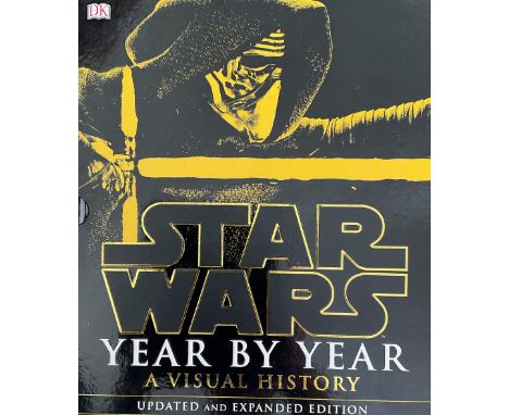 Star Wars. Star Wars Year by Year- A Visual History, Updated and Expanded Edition Hardback Book. Inside page has a collection
