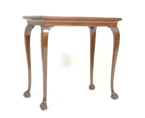 An 18th century revival George III style mahogany silver / side / occasional table having a flared top, carved spandrels, cur