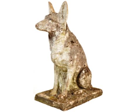 A large 20th Century composite stone garden ornament figure in the form of a German Shepherd. The dog in a seated potions rai