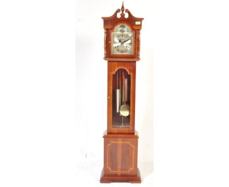 A 20th century mahogany cased&nbsp; Tempus Fugit longcase granddaughter clok. The clock with 31 day movement marked for Laura