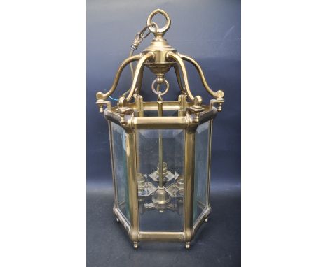 A vintage retro 20th century brass and glass porch lamp / lantern by Mod Dep Lamp Art. The lamp of a hexagonal form with six 