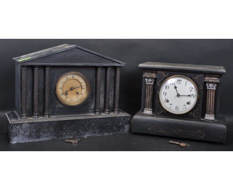 An early 20th century slate 8 day mantel clock of architectural form having a brass and enamel clock face with Roman numerals