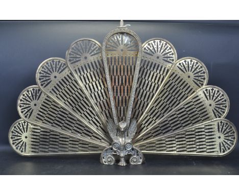 A 20th century Victorian style &nbsp;" peacock feather " brass metamorphic fire screen, folding in nine segments with pierced