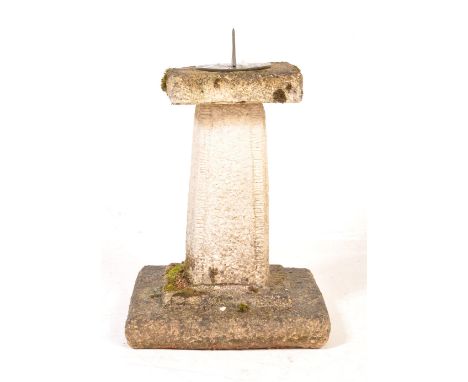 A late 20th century composite stone sundial having a circular metal dial with square platform raised on a tapering column ato