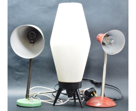 A collection of three retro vintage 20th century lamps comprising of two anglepoise gooseneck lamps raised on circular bases 