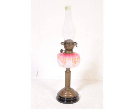 A 19th century Victorian oil lamp / paraffin lamp. The lamp having a clear glass funnel, pink colour oil reservoir decorated 