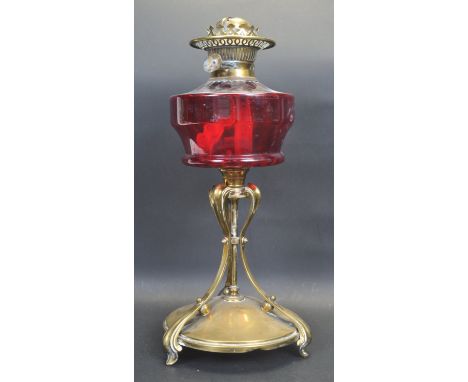 A 19th century Victorian Art Nouveau oil lamp / table oil lamp. The oil lamp having a brass pierced burner with twin wick rai