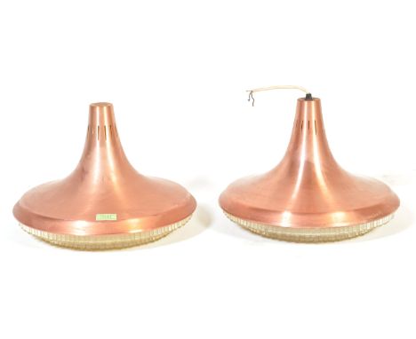 A pair of retro vintage industrial circa 1970s light shades having a brass shade of tapering circular form with beaded plasti
