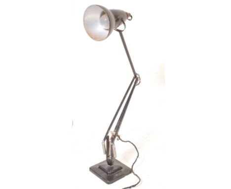 A 20th Century circa 1940's Industrial pre-war Herbert Terry anglepoise lamp, raised on a cast metal two step base with penda