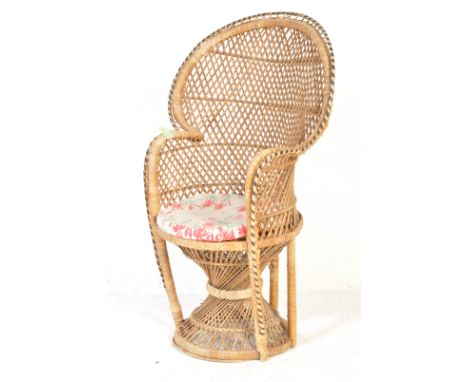 An retro vintage 20th Century circa 1950’s wicker &amp; cane peacock chair having a circular fan back with woven border, inte