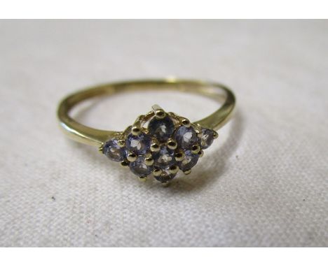 Gold stone set cluster ring