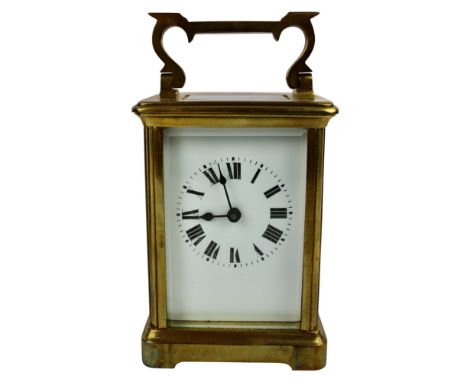 An Edwardian brass carriage clock, the movement stamped Made in France, together with a winding key and fitted case.
Height e