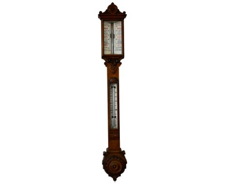 A Victorian Oak mercury stick barometer, in a carved heavy oak carved case, twin vernier scale adjusters. Dial signed Benetfi