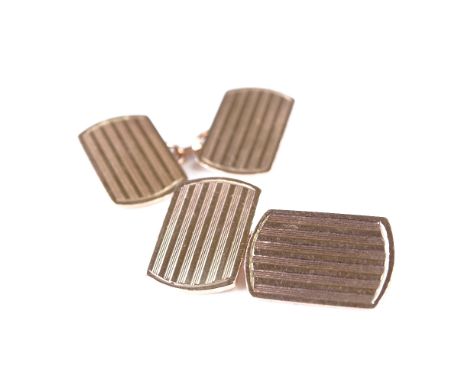 A pair of 10ct rose gold curved rectangular panel cufflinks, engine turned decoration, panel length 16.2mm, 7.3gGood original