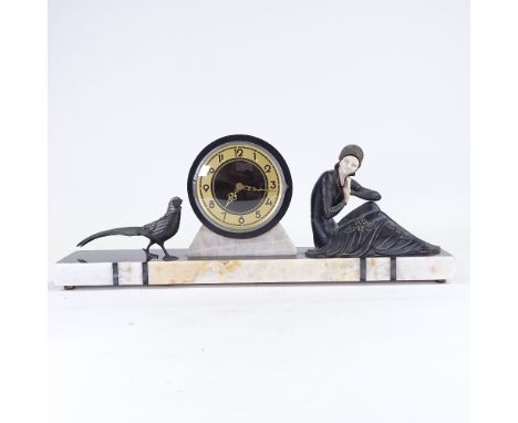 An Art Deco 2-colour marble mantel clock, surmounted by spelter woman and pheasant, replacement battery operated movement, pl