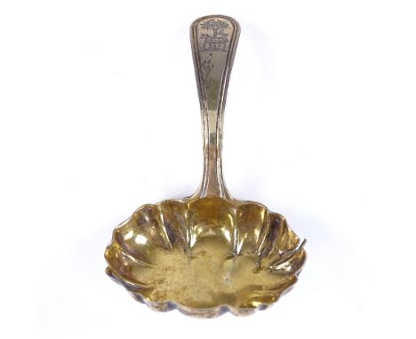 A George III silver-gilt caddy spoon, reeded handle with scalloped bowl, by Duncan Urquhart & Naphtali Hart, length 7.7cmFair