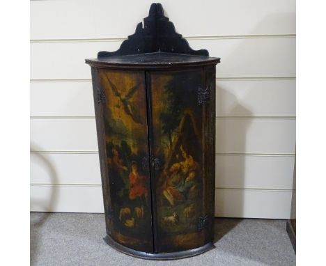 A 19th century bow-front 2-door hanging corner cupboard, with painted religious scene, height to top shelf 92cmPaintwork is d