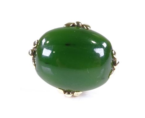 A late 20th century 9ct gold cabochon jade dress ring, setting height 17.5mm, size O/P, 9.2gVery good original condition, no 