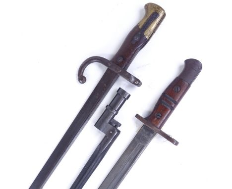 A First War Period sword bayonet with leather scabbard, and 2 other early 20th century bayonets (3) 