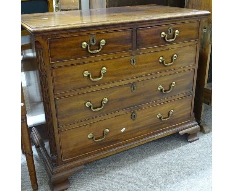 A George III mahogany chest of 3 long and 2 short drawers, with blind fret carved corners, and ogee bracket feet, width 94cm,