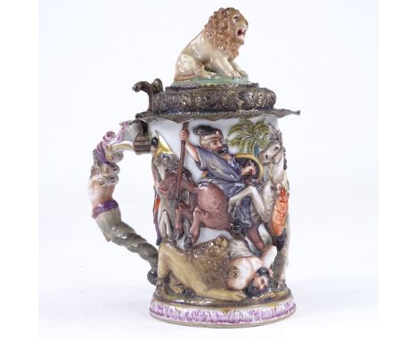 A Capodimonte porcelain tankard, relief moulded Classical battle scene decoration surmounted by a lion, silver-gilt mounts, h