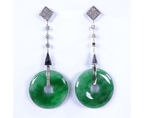 A pair of Art Deco style unmarked white metal jade onyx and diamond drop earrings, jade bi disc suspended from diamond set ho