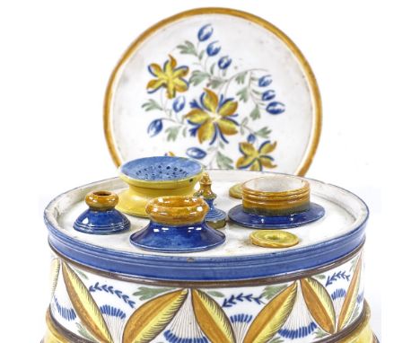 A 19th century Pratt Ware ceramic drum-shaped desk stand and cover, the interior fitted with original inkwells and desk sande