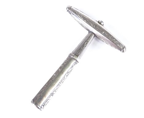 A 19th century Dutch silver? white metal travelling corkscrew, engraved foliate decoration with screw barrel cover and steel 