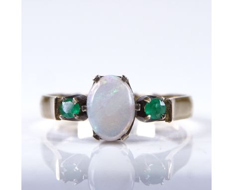 A late 20th century unmarked gold 3-stone cabochon opal and emerald dress ring, setting height 7.2mm, size N, 2.3gGood overal