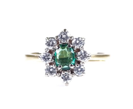 A late 20th century 18ct gold emerald and diamond cluster dress ring, setting height 10.4mm, size J/K, 2.6gGood overall condi