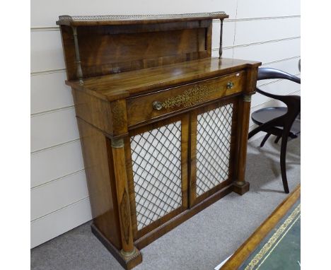 A Regency rosewood secretaire chiffonier, brass-mounted panelled shelf above, brass inlaid secretaire drawer with fitted inte