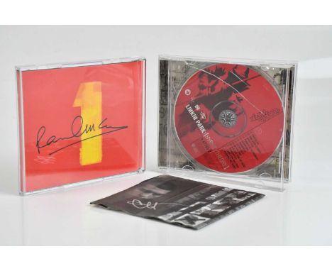 PAUL MCCARTNEY; a  signature on the back of The Beatles CD album cover, with a Chester Bennington autograph on the intert of 