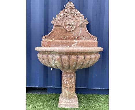 Italian style red and white veined marble wall water fountain, shaped raised back with scrolled foliate decoration and flower