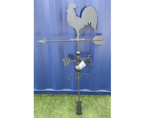 Black finish metal weather vane with cockerel finial, the stem decorated with c-scrolls, with wall mount bracket Dimensions: 